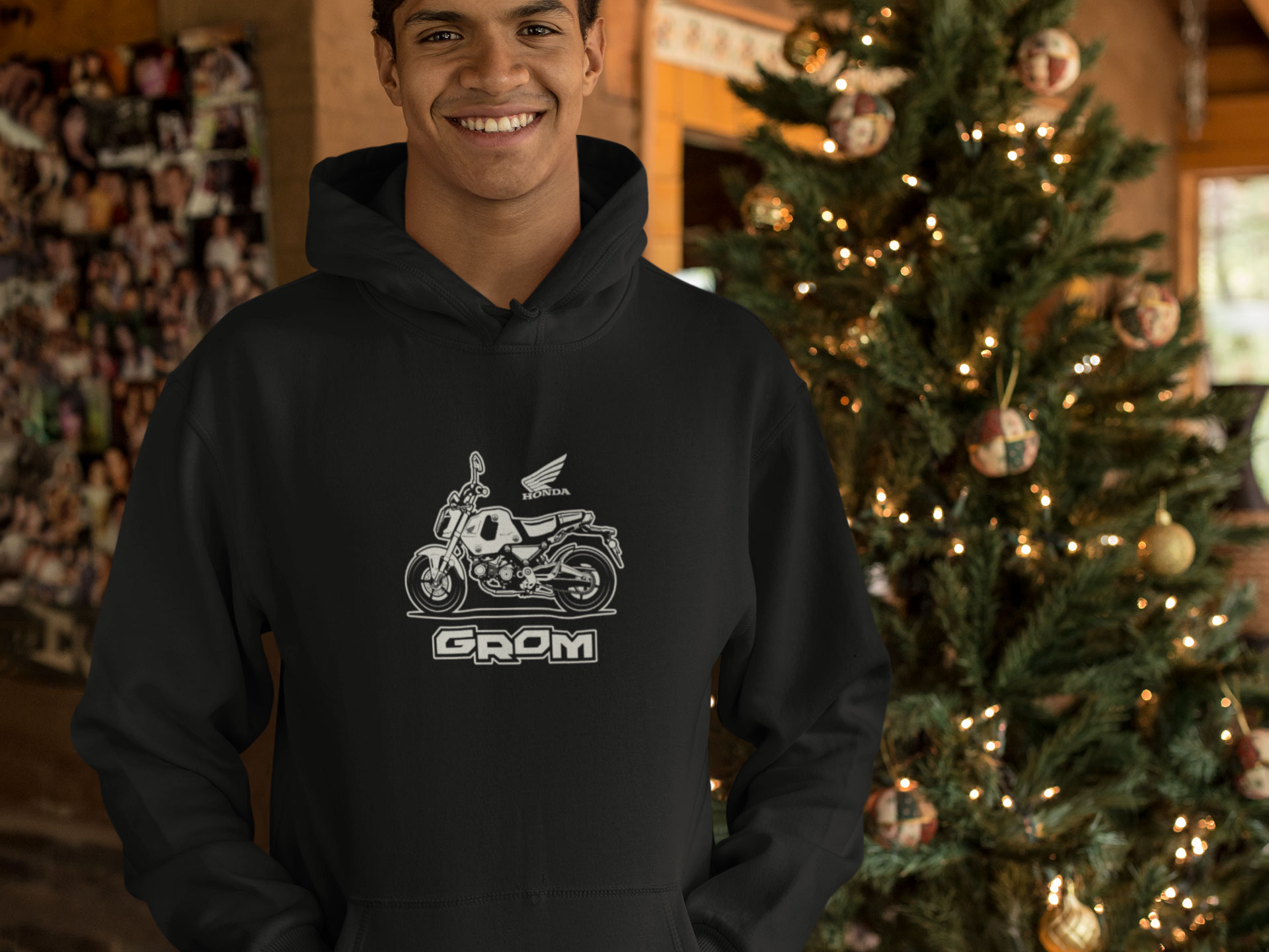 Noel Outfits Store -Noel Outfits Store mockup of a man wearing a hoodie in front of a beautiful christmas tree 23510